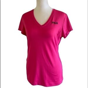 FILA exercise shirt. ‎ Size rubbed off , but looks like a small size.